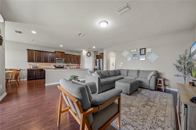 living room featuring dark wood-type flooring