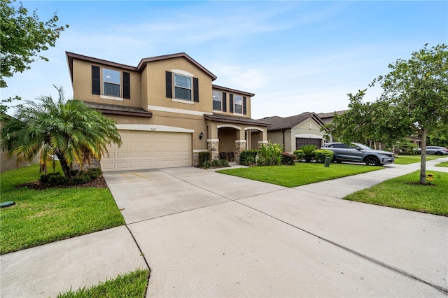 view of front of house with a garage and a front yard