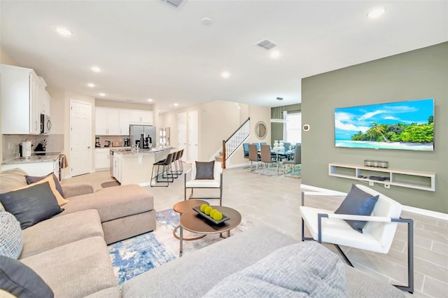 living room featuring light tile patterned flooring