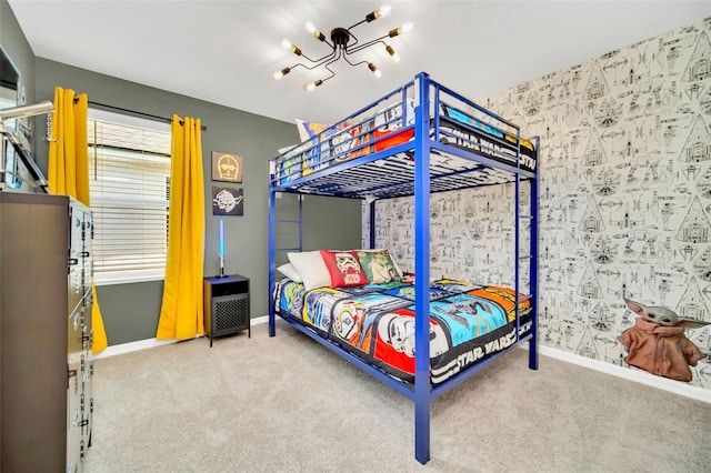 bedroom with a notable chandelier and carpet floors