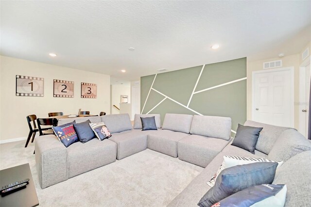 living room featuring light carpet