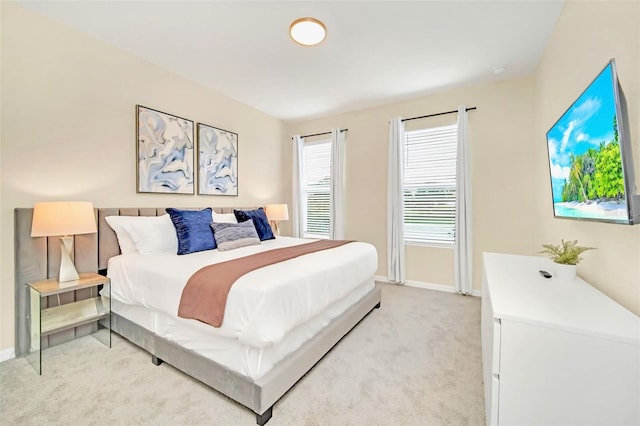 bedroom with light colored carpet