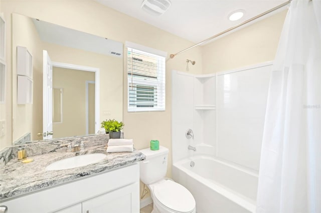 full bathroom featuring shower / tub combo, toilet, and vanity