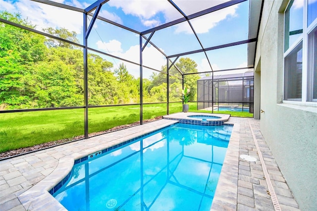 view of swimming pool with an in ground hot tub, glass enclosure, and a lawn