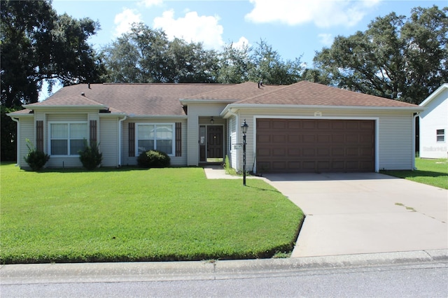 single story home with a garage and a front yard