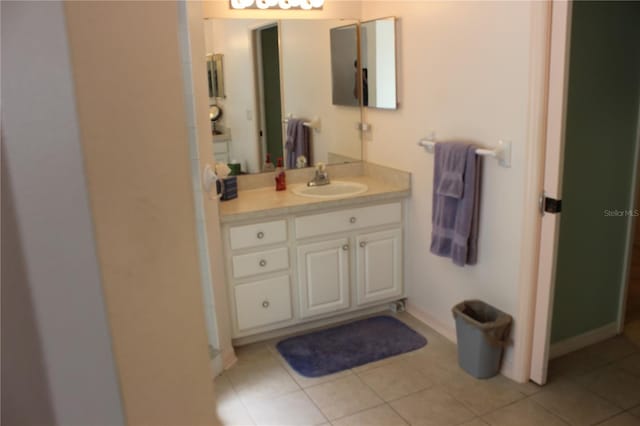 bathroom with tile patterned floors and vanity