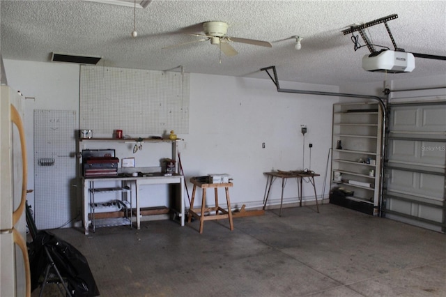 garage featuring white fridge, a garage door opener, and ceiling fan