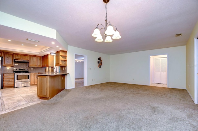 kitchen featuring stainless steel range with electric cooktop, decorative light fixtures, light tile patterned floors, and an inviting chandelier