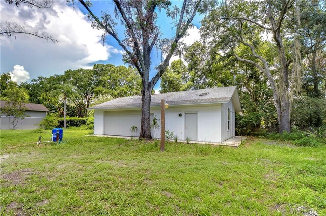 view of outdoor structure with a lawn