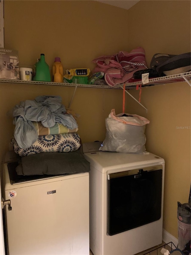 laundry room featuring laundry area and separate washer and dryer