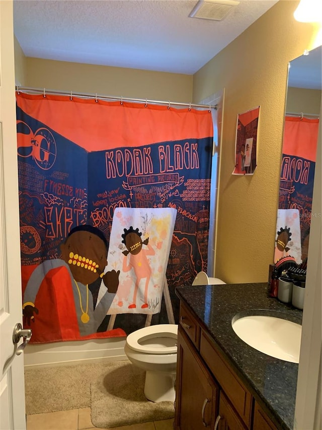 full bath featuring visible vents, toilet, a textured ceiling, tile patterned flooring, and vanity
