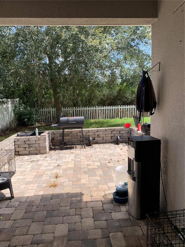 32502 Summerglade Dr, Wesley Chapel, FL 33545 - view of patio with a fenced backyard, area for grilling, and view of wooded area