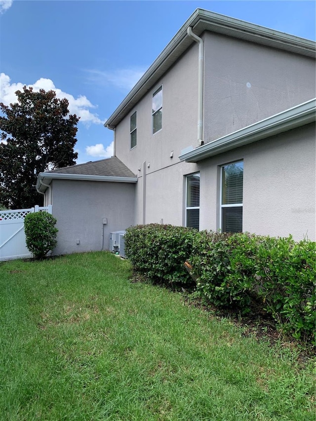 view of home's exterior with a yard