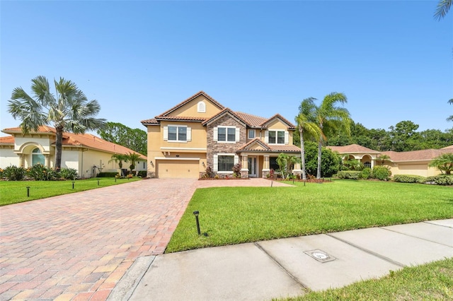 mediterranean / spanish-style house with a front lawn and a garage