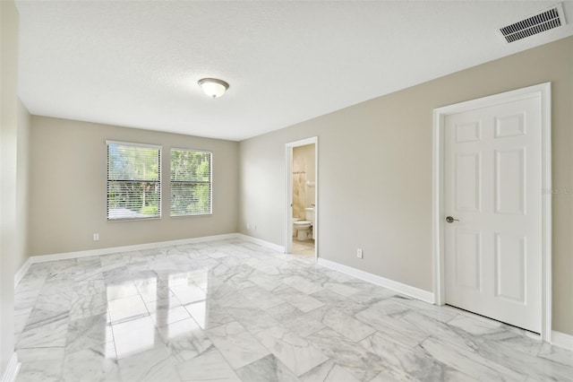 empty room with a textured ceiling