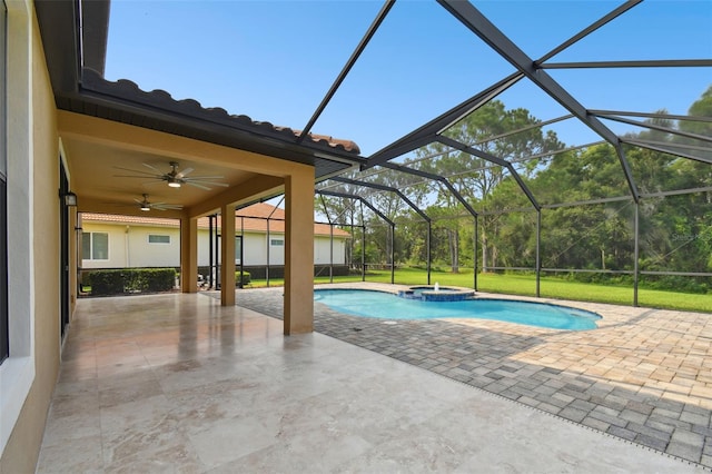 view of swimming pool with a lanai, a patio area, and ceiling fan