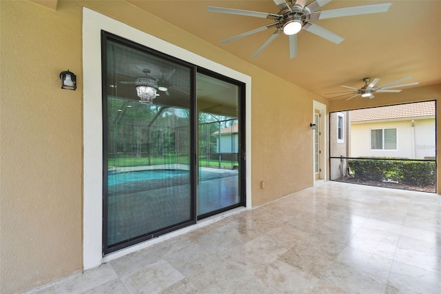 view of patio featuring ceiling fan