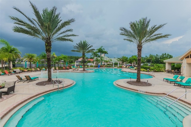 view of swimming pool with a patio