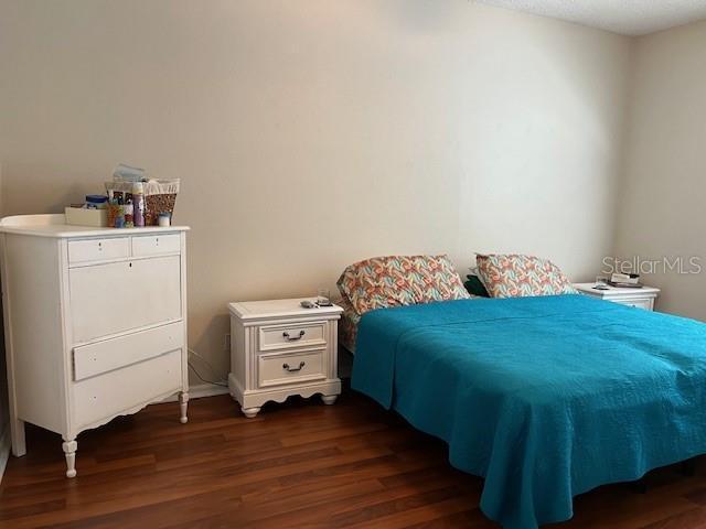 bedroom featuring dark hardwood / wood-style floors