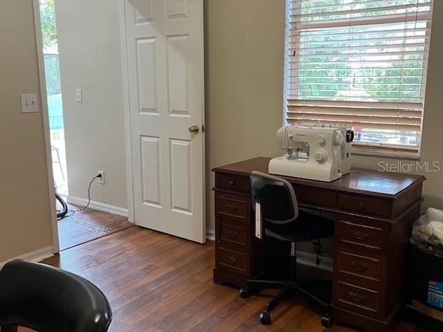 office area with baseboards and wood finished floors