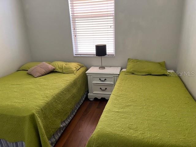 bedroom featuring dark hardwood / wood-style flooring