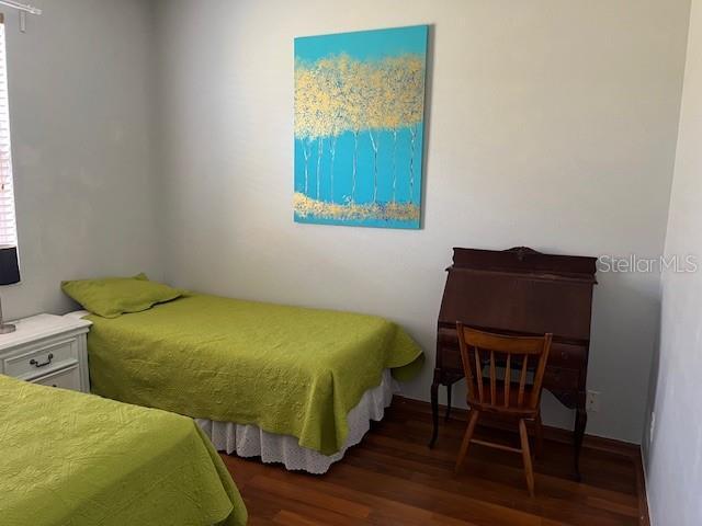 bedroom featuring wood finished floors