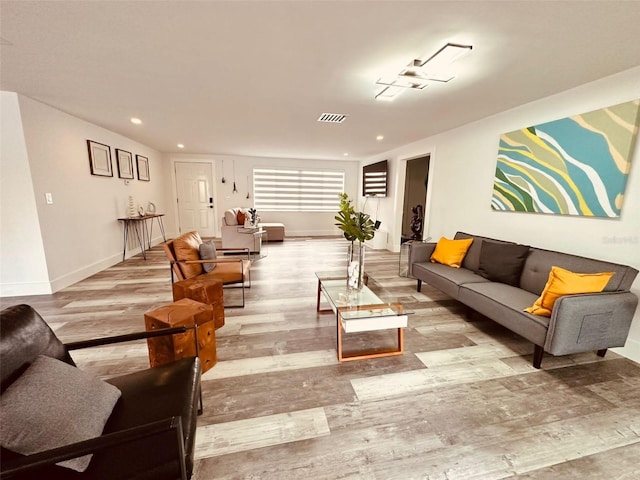 living room with light hardwood / wood-style flooring