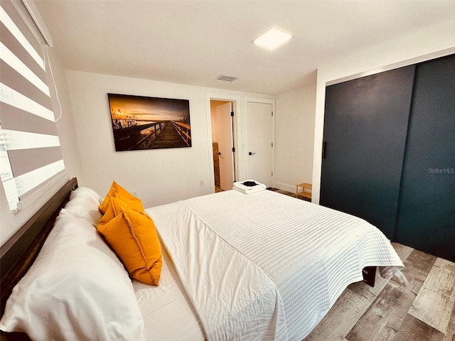 bedroom with light hardwood / wood-style floors