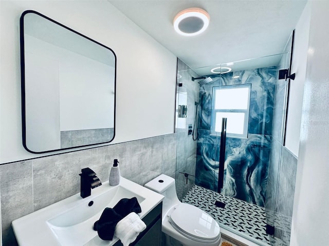 bathroom featuring a shower with door, tasteful backsplash, tile walls, toilet, and vanity