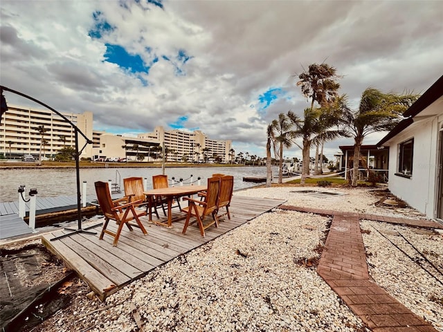 exterior space featuring a water view and a dock