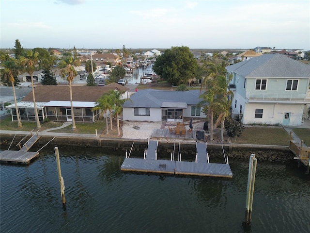 exterior space with a water view and a patio area