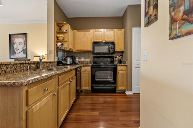 kitchen featuring tasteful backsplash, dark wood-type flooring, sink, black appliances, and dark stone countertops