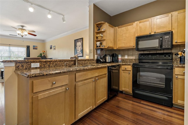 kitchen featuring sink, backsplash, kitchen peninsula, dark stone counters, and black appliances