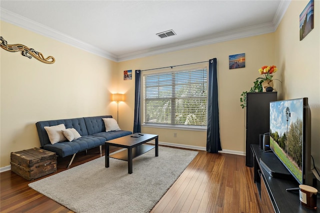 living room featuring crown molding and dark hardwood / wood-style floors