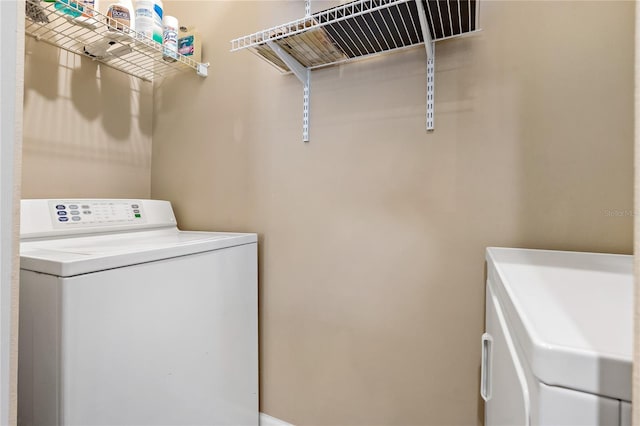 washroom featuring independent washer and dryer