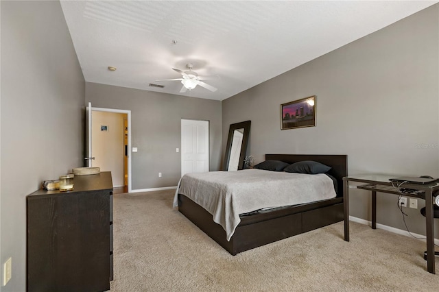 carpeted bedroom with ceiling fan