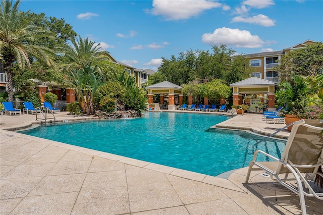 view of swimming pool with a gazebo and a patio