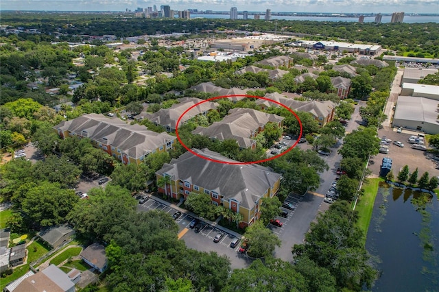 birds eye view of property with a water view