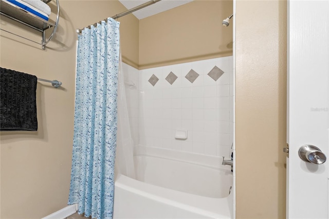 bathroom featuring shower / tub combo with curtain