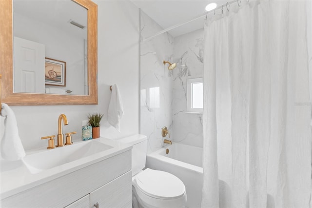 full bathroom with vanity, toilet, and shower / tub combo