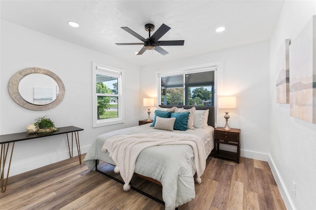 bedroom featuring hardwood / wood-style floors and ceiling fan