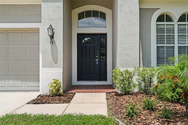 doorway to property featuring a garage