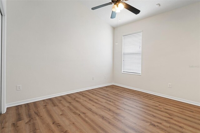 empty room featuring ceiling fan and hardwood / wood-style flooring