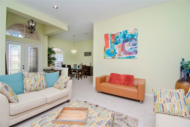 living room with french doors and light tile patterned floors