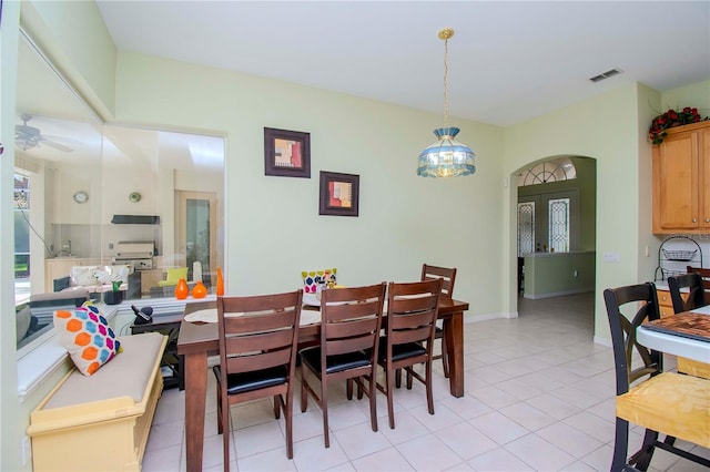 dining room with light tile patterned flooring and ceiling fan