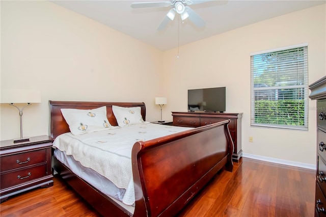 bedroom featuring ceiling fan and dark hardwood / wood-style flooring