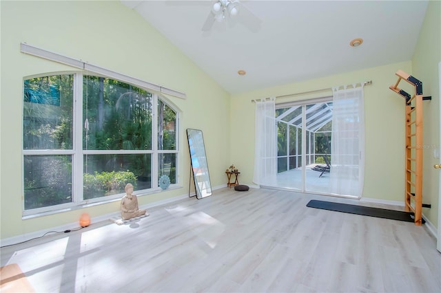 spare room featuring ceiling fan, lofted ceiling, and light hardwood / wood-style floors