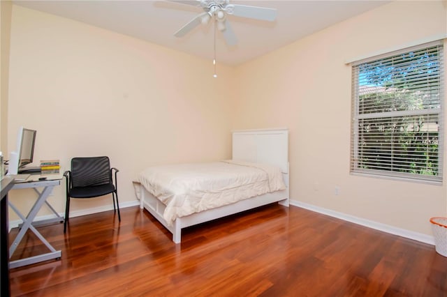 bedroom featuring ceiling fan and hardwood / wood-style flooring