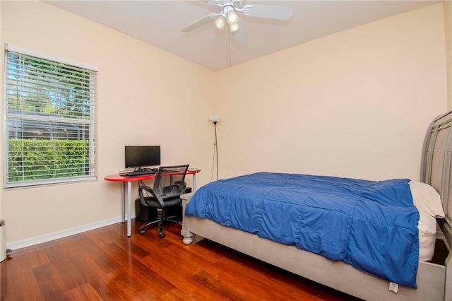 bedroom with wood-type flooring and ceiling fan