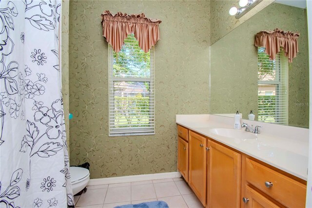 bathroom featuring tile patterned floors, vanity, and toilet